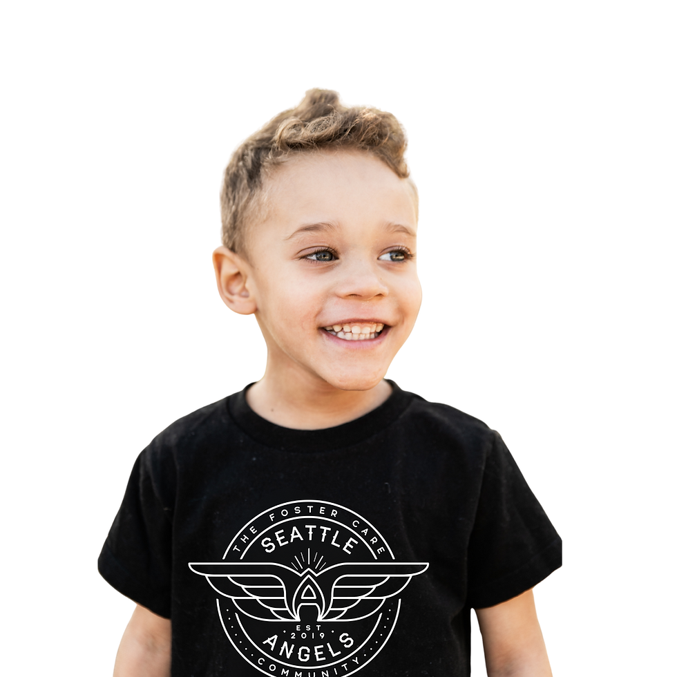 A smiling young child with short curly hair wearing a black t-shirt that has a white logo reading 'Seattle Angels'